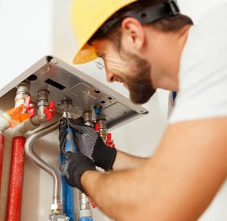 plumber installing a water heater 