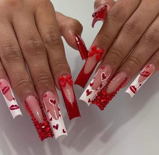 a woman's hands with red and white hearts on them
