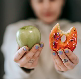 a woman holding a donut and a donut