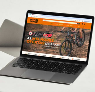 a laptop computer screen showing a website page on the left side of the screen