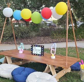 teepee picnic table rissler theme with balloon garland