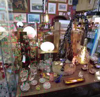 Chain light and curios  @jkfarm.co.uk chain light, paper weights,  Africana,  carved statue 