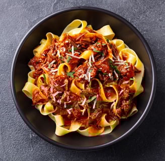 bolognese in black bowl