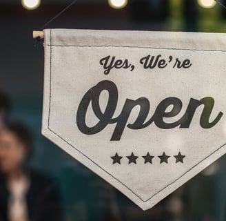 a sign that says yes we're open