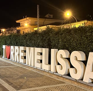 a sign that says i love you in the middle of the street