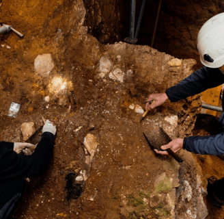 Archeologist near the cave at the Sima del Elefante site