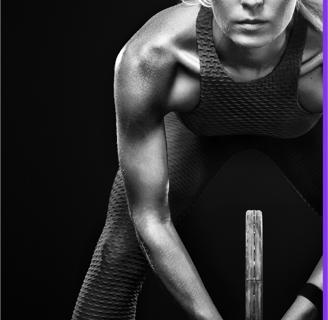 a woman in a sports bra and a tennis racket