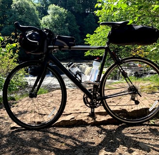 Bike with full kit by the waterfall
