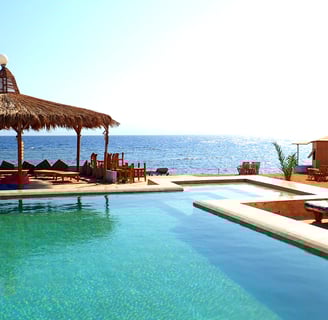 Sun playing with the sea and the pool in the winter