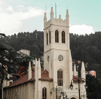 a church with a steeple and a clock tower