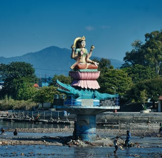 a statue of a woman sitting on a pedestal