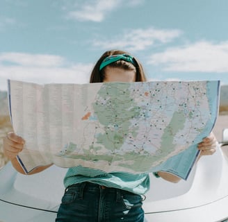 a woman holding a map of a map of a map of the world