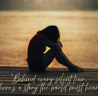 A female crying sitting by the water. “Behind every silent tear, there’s a story the world must hear