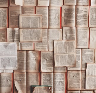 a wall of books and a bottle of wine