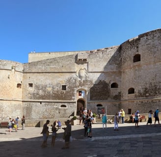 Historic Aragonese Castle in Puglia, Italy, overlooking the turquoise Adriatic Sea, medieval 