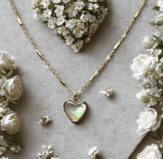 a heart shaped necklace with a heart shaped pendant