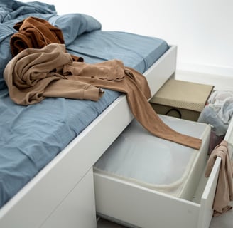 a bed with a blanket and a blanket on top of it