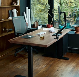 a desk with a laptop and a laptop on a wooden desk