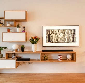 a living room with a television and a picture frame