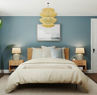 a bedroom with a bed and a lamp