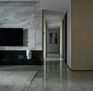 a long hallway with a television and a flat screen tv