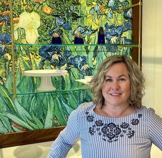 Woman posing in front of stained glass.