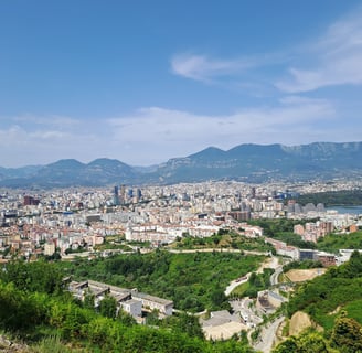 a view of a city from a hill top