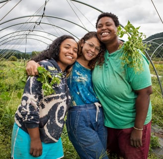 a group of people standing in a garden