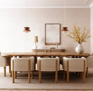 a dining room table with a vase of flowers, and chairs