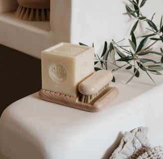 cube shaped soap and brush on counter top
