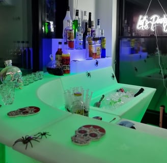 SweetAz Co. corner LED glow bar setup featuring Halloween-themed colours and accessories in Redlands