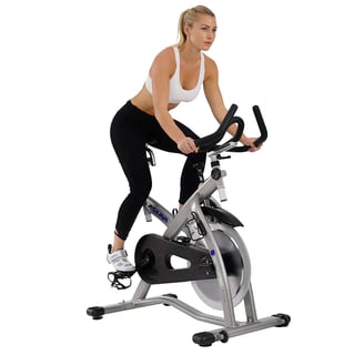 women riding exercise bike
