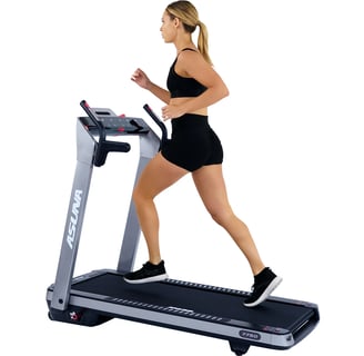 women running on treadmill