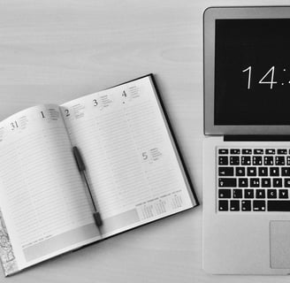 a laptop computer and notebook with a notebook and a notebook