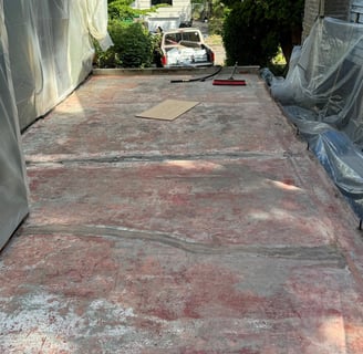 Layers of Paint and sealer on a 1930's concrete roof