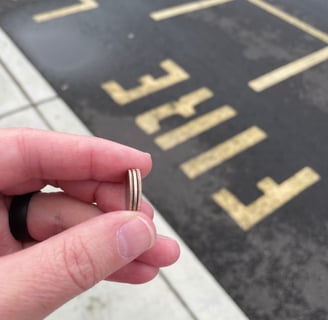 a person holding a ring with a ring on it