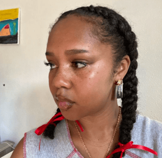 middle part two braids hairstyle