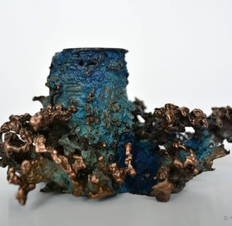 Photographie d'un bougeoir en bronze représentant des coraux