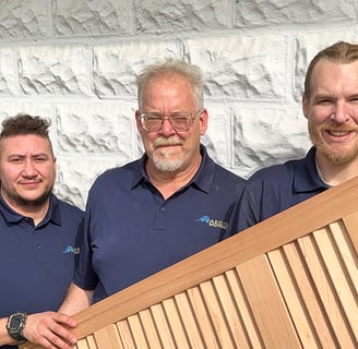 The Aegis Team holding one of their exterior shutters