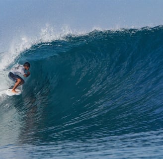 Surfer getting barreled at an Afulu Wave