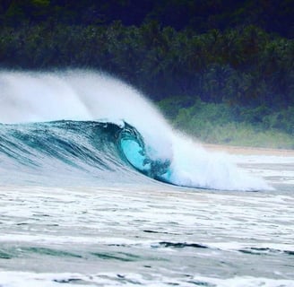 Beach break wave in Afulu. Fun peaks for surfing right out front.