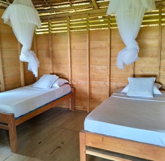 Simple and clean double occupancy bungalows at Afulu Surf Resort