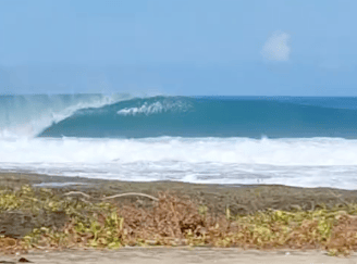 Powerful barreling left-hander in front of Afulu Surf Resort