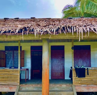 Private bungalows at Afulu Surf Resort in paradise near perfect waves