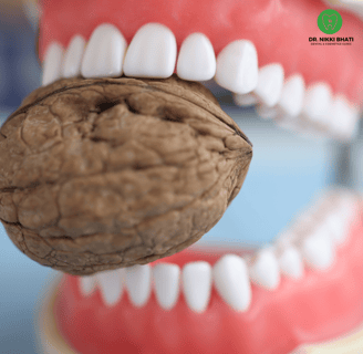 Healthy foods like greens, dairy, nuts, and fish, highlighting dental care tips for strong teeth and