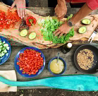 A person enjoying a healthy meal with fruits, vegetables, and whole grains