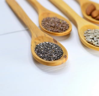 A variety of seeds including chia, flax, pumpkin, sunflower, and sesame seeds