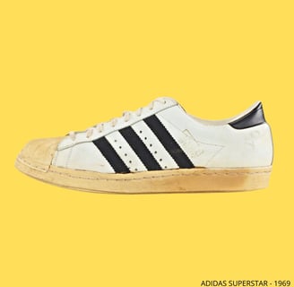 a pair of  first adidas superstar sneakers -1969