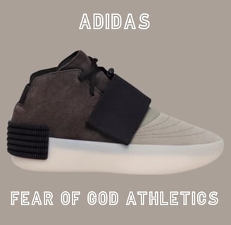 a pair of sneakers brown  and off white adidas - fear of god athletics