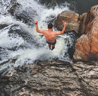 jumping into jacuzzi hole at Mkambati Falls